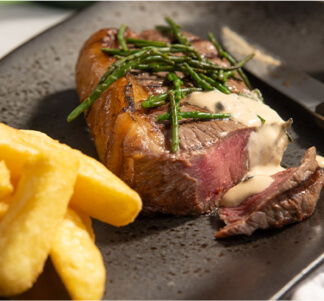 Bar and Block rump steak cooked rare with chips and samphire.