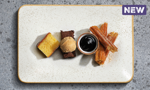Bar and Block dessert item with churros chocolate sauce and a brownie with ice cream on a cream plate