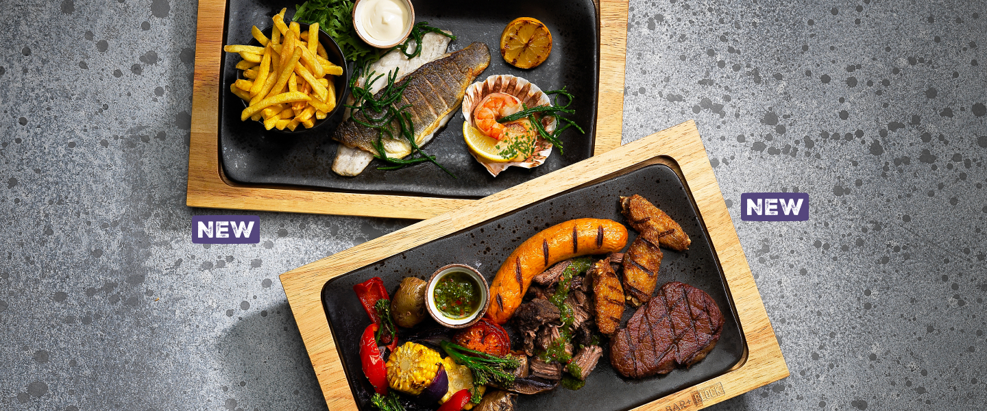 Two Bar and Block menu items with sea bass, prawns, rump steak, chicken wings and burnt ends.