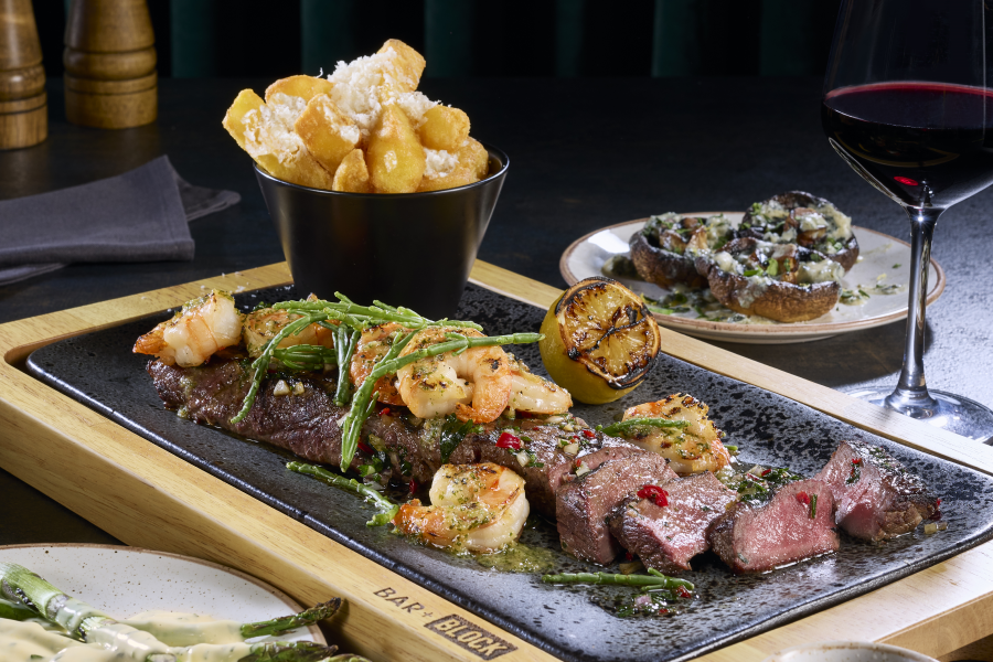 Bar + Block steak on plate with red wine
