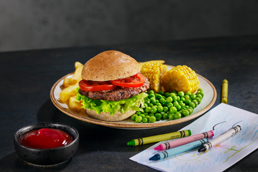 bar and block kids burger meal on table with crayons