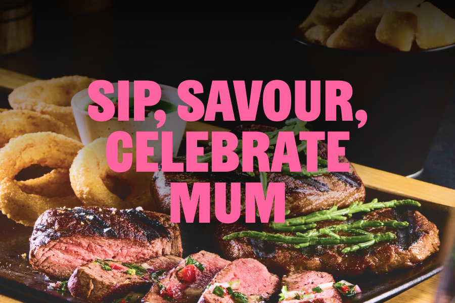 Bar + Block steak sampler with sliced steak, triple-cooked chips, onion rings and dipping sauces on a wooden board