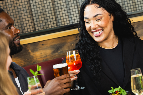 bar and block people drinking and saying cheers