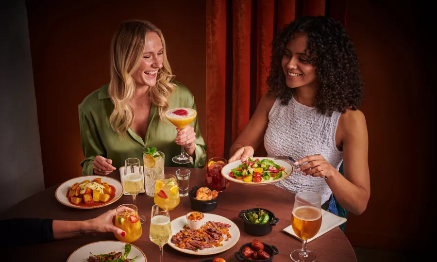 bottomless brunch people drinking with food on table